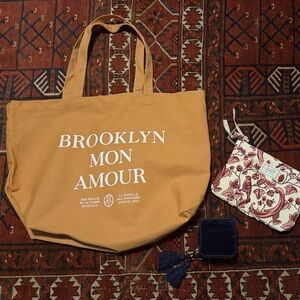Sezane tote, pouch, and jewelry case set.